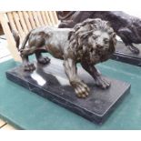 BRONZE LION, on marble base, 38cm L.