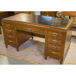 ART DECO PEDESTAL DESK, early 20th century walnut and silvered metal mounted with nine drawers,