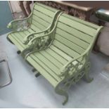 GARDEN CHAIRS, a pair, cast iron lion heads ends with wooden slats in a green painted finish,