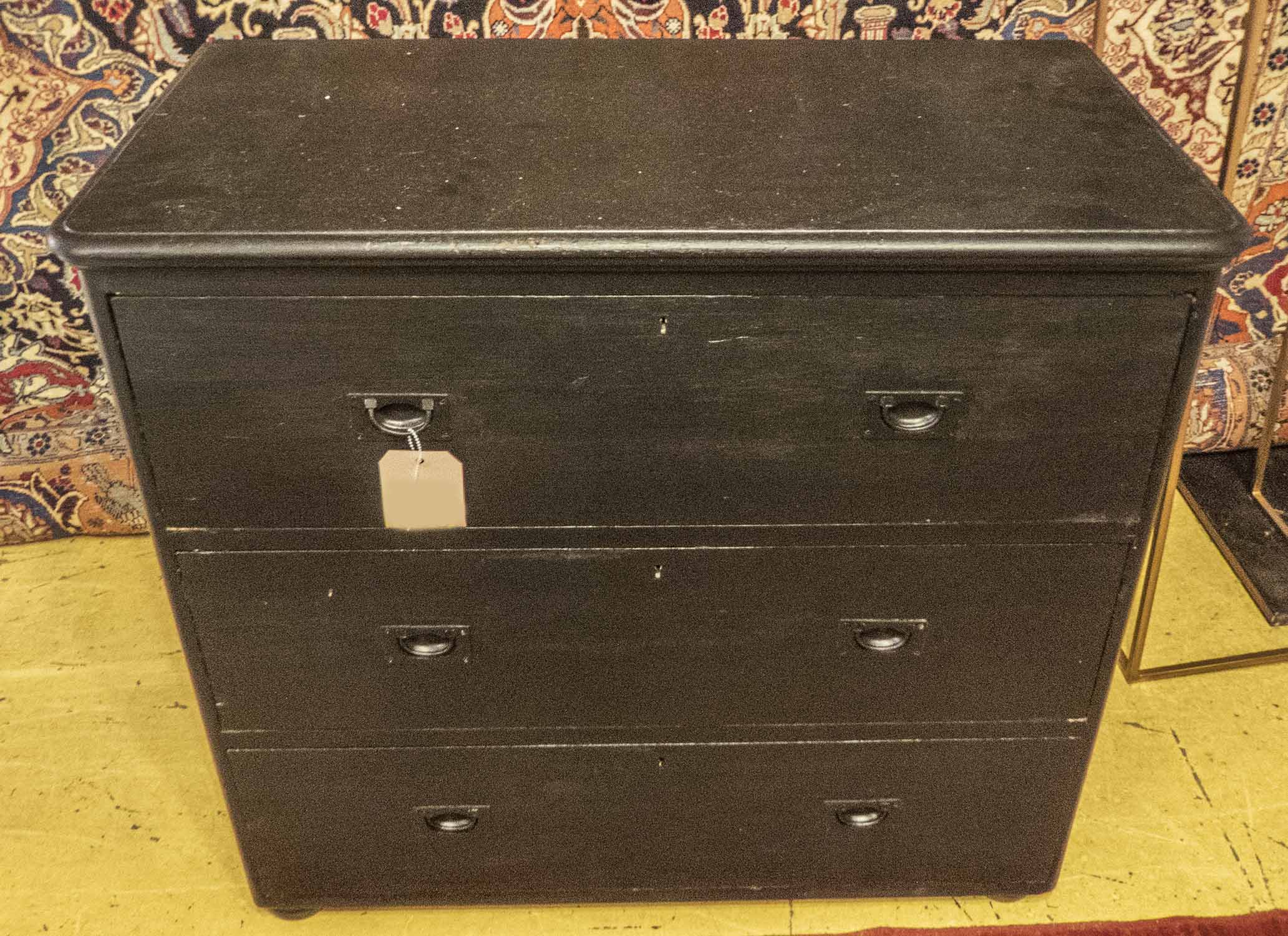 CHEST, 19th century black painted with three drawers and military style recessed handles,