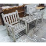 GARDEN ARMCHAIRS, a pair, weathered teak of substantial form,