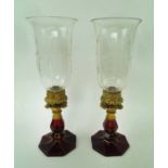 BOHEMIAN GLASS CANDLE LIGHTS, a pair, with engraved shades, gilt metal mounts, each 43cm H max.