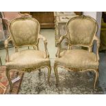 FAUTEUILS, a pair, late 19th/early 20th century French, painted and gilt heightened,