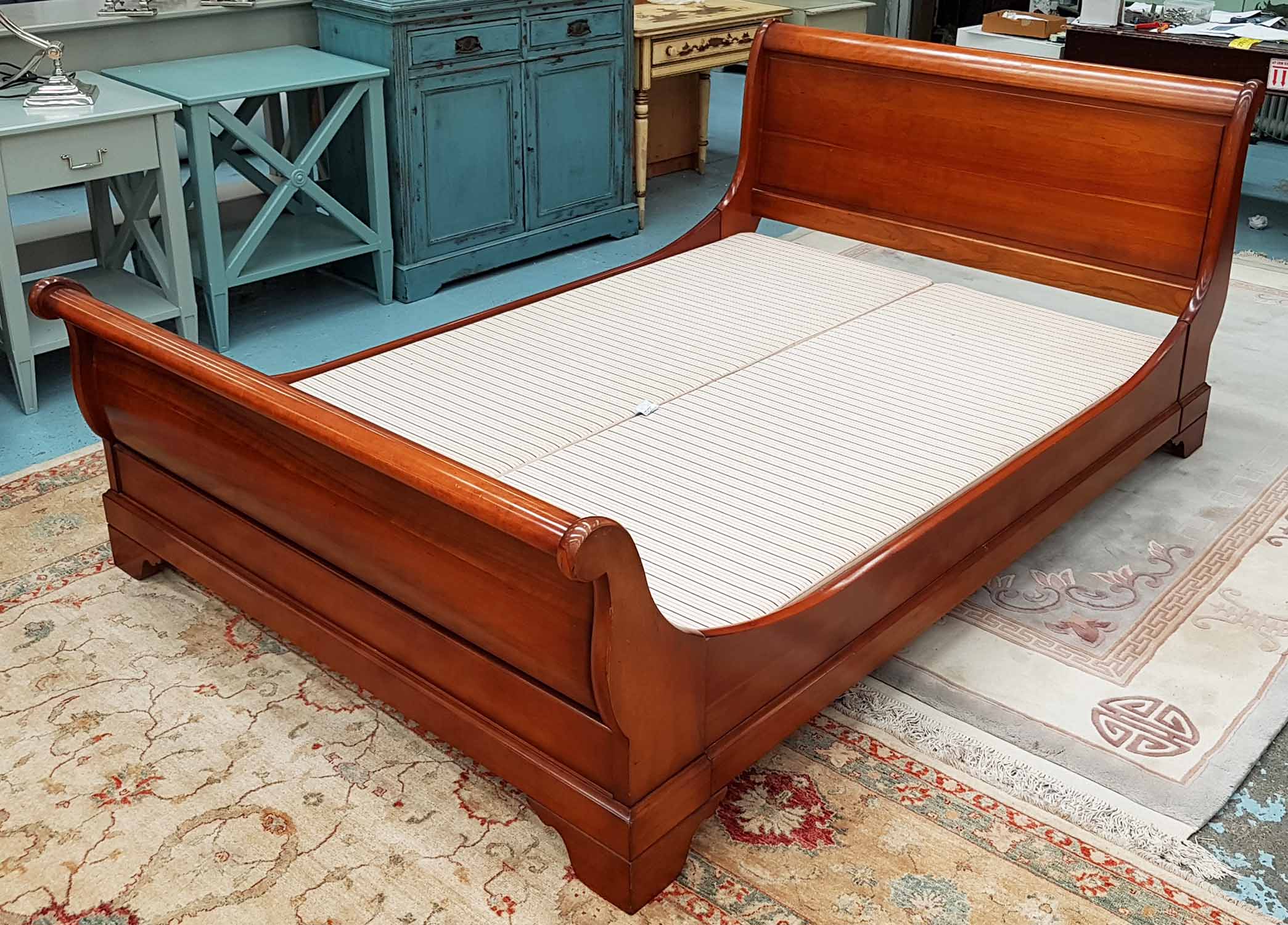 SLEIGH BED, 4ft 6in, in mahogany with base, (no mattress).