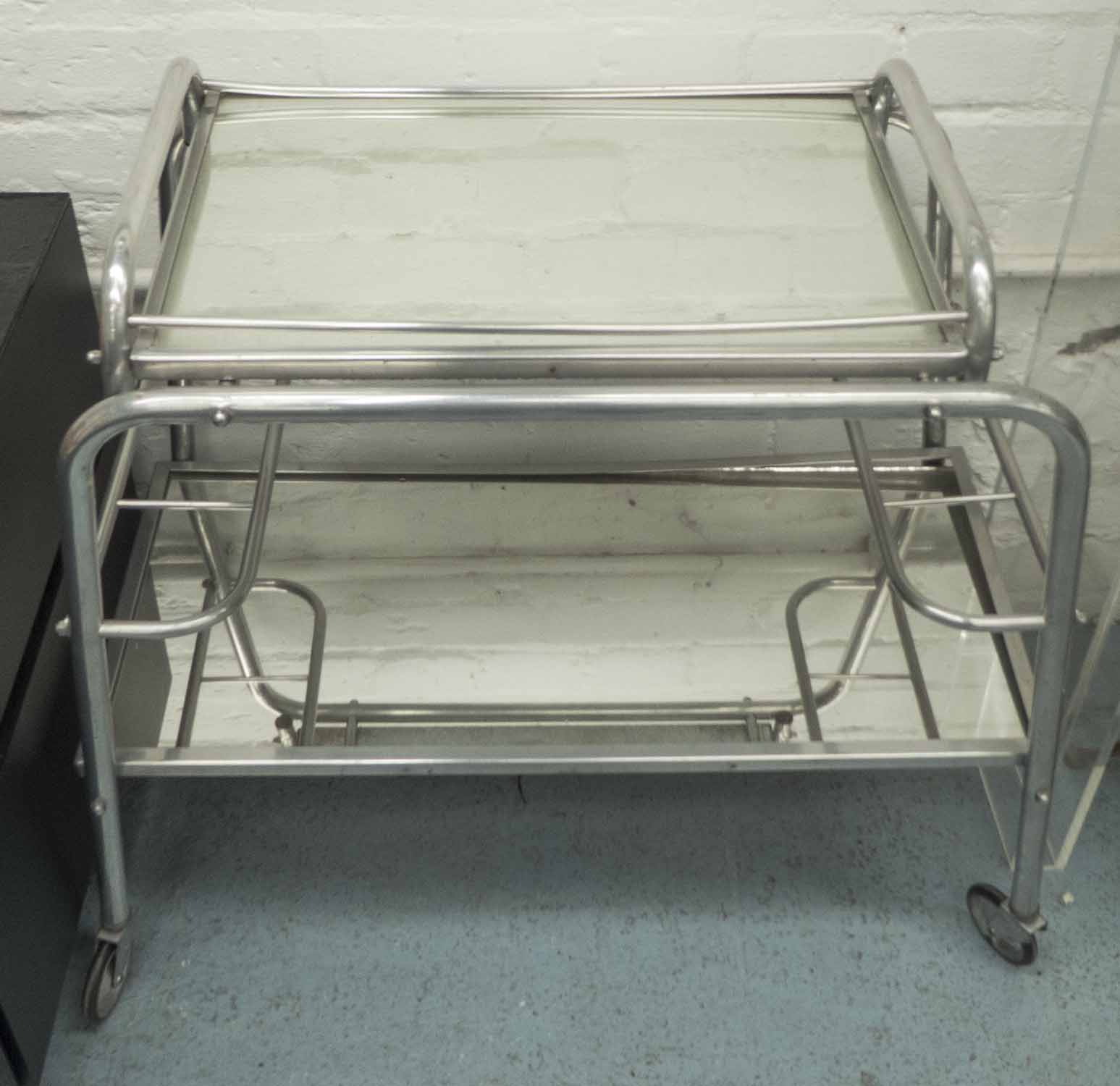 COCKTAIL TROLLEY, mid century, polished tubular metal construction with mirrored tray,