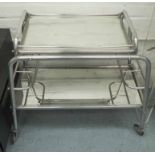 COCKTAIL TROLLEY, mid century, polished tubular metal construction with mirrored tray,