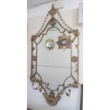 WALL MIRROR, giltwood with a surmount in the form of urn with an Adamesque foliate tracery,