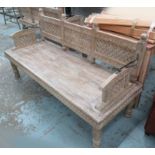 CONSERVATORY BENCH, Indian style in wood, heavily carved detail on turned supports, 181cm L.