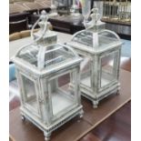STORM LANTERNS, a pair, square form in distressed180 effect painted metal finish, 58cm H.