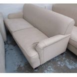 HOWARD STYLE SOFA, two seater, in neutral fabric on turned castor supports, 196cm L.