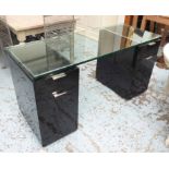 DESK, the glass top on a black lacquered pedestal, each with a drawer and a cupboard, 60cm x 150cm.