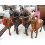 HORSES, two pairs, finely carved and ornately painted, largest 59cm L, smallest 43cm L.