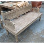 CONSERVATORY BENCH, Indian style in wood, heavily carved detail on turned supports, 181cm L.