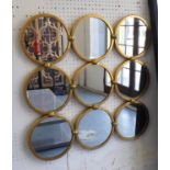 MIRRORED WALL ART, with nine circular mirrors in a gilded frame, 68cm x 68cm.