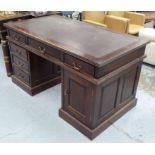 PEDESTAL DESK, 20th century hardwood, fitted with six drawers and a cupboard around the kneehole,