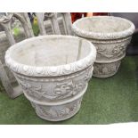 PLANTERS, a pair, in reconstituted stone, conical shape, egg and dart and floral swags,