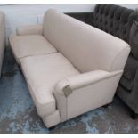 HOWARD STYLE SOFA, two seater, in neutral fabric on turned castor supports, 196cm L.