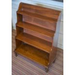 WATERFALL BOOKCASE, Regency mahogany of small proportions with open cascading shelves,