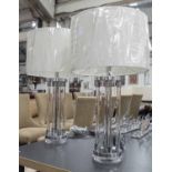 TABLE LAMPS, a pair, with lucite columns, on chromed metal base, with shades 68cm .