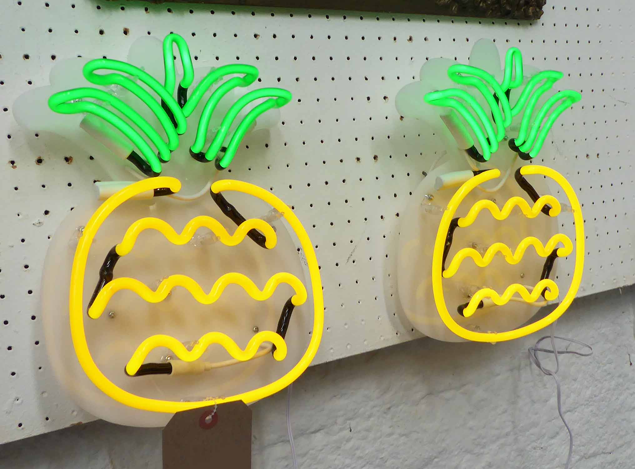 NEON LIGHTS, a pair, pineapple design, 29cm H.