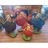 FOUR LARGE CHICKENS, West African, carved and painted wood, tallest 74cm H.