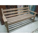 GARDEN BENCH, 1970's, weathered teak, slatted with horizontal slats, 161cm W.