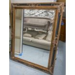 WALL MIRROR, Italian style, rectangular bevelled plate, with antique gilded and ebonised frame,