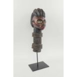 YORUBA HEAD POST CARVING, Nigeria, carved and painted wood, 47cm H, with bespoke display stand.