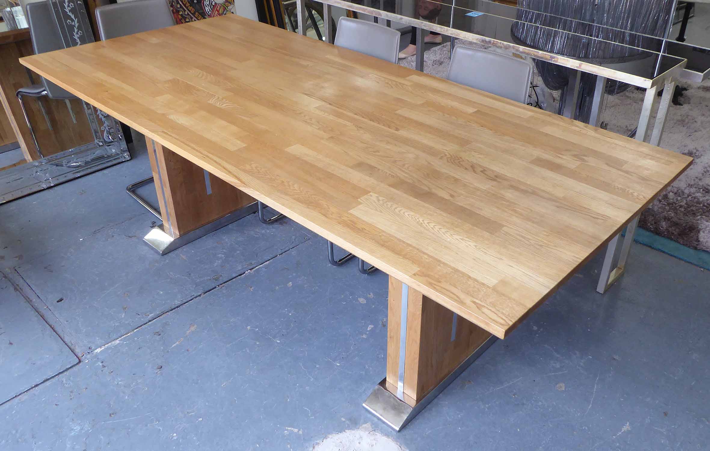 BESPOKE RECTANGULAR DINING TABLE, oak top, raised on oak and chrome inset footed supports,