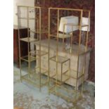 TALL FLOOR STANDING ETAGERES, a pair, gilt metal framed, each enclosing multiple glass shelves,