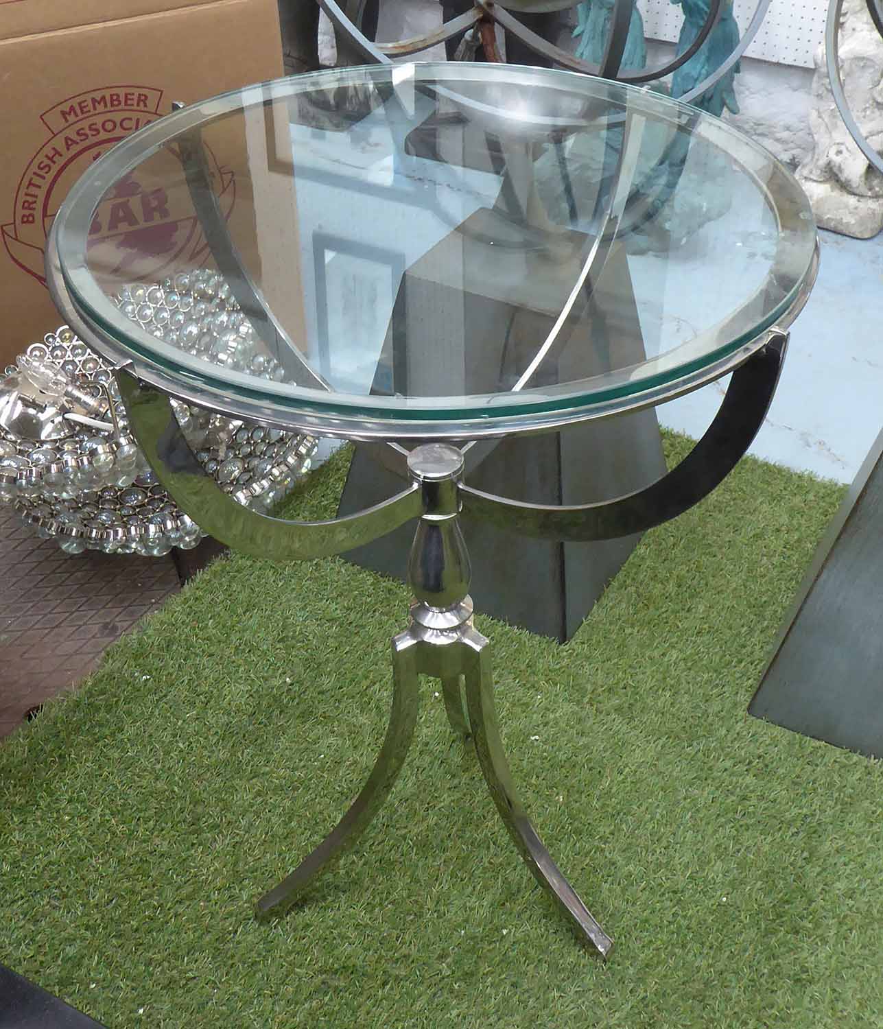 SIDE TABLE, glass top, metal frame, polished on triform supports, 65cm H x 50cm.