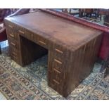 PEDESTAL DESK, Art Deco with brown leather top above nine drawers, 78cm H x 37cm W x 77cm D.