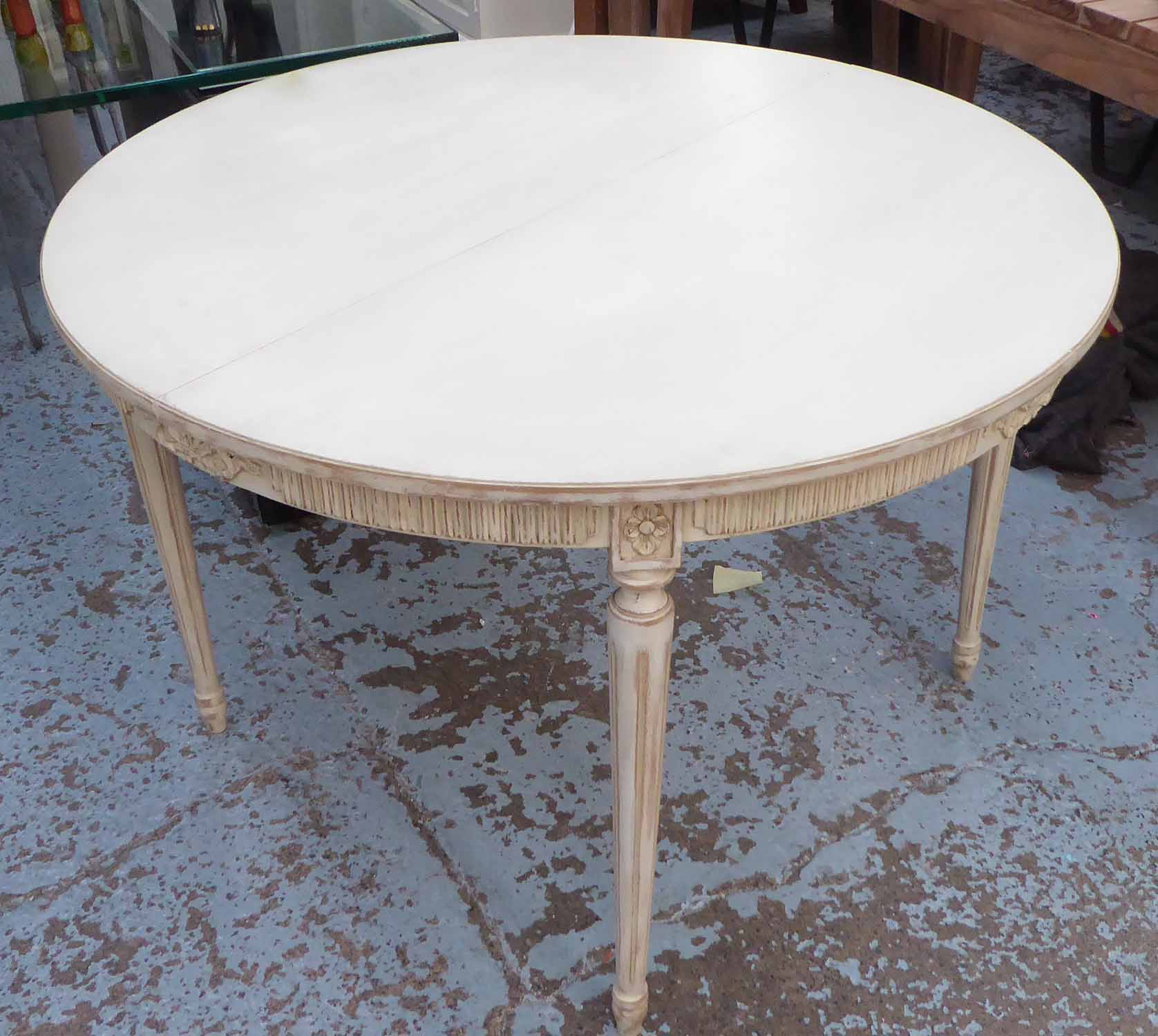 DINING TABLE, French style, round top with ribbed and ribbon frieze, on fluted tapering legs,