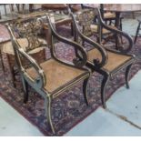 ARMCHAIRS, a pair, Regency design, ebonised and gilded, with scroll arms,