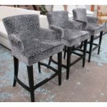 BAR STOOLS, a set of three, ebonised framed, each with grey patterned velvet effect upholstery,