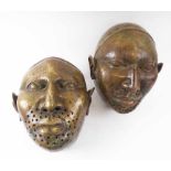 BRONZE IFE FACE MASKS, a pair, each 31cm H x 25cm W.