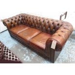 CHESTERFIELD SOFA, three seater, buttoned light tanned leather, on castors, 207cm L.