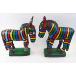 WEST AFRICAN WOODEN ZEBRA CARVINGS, two similar, both with brightly painted coloured stripes,