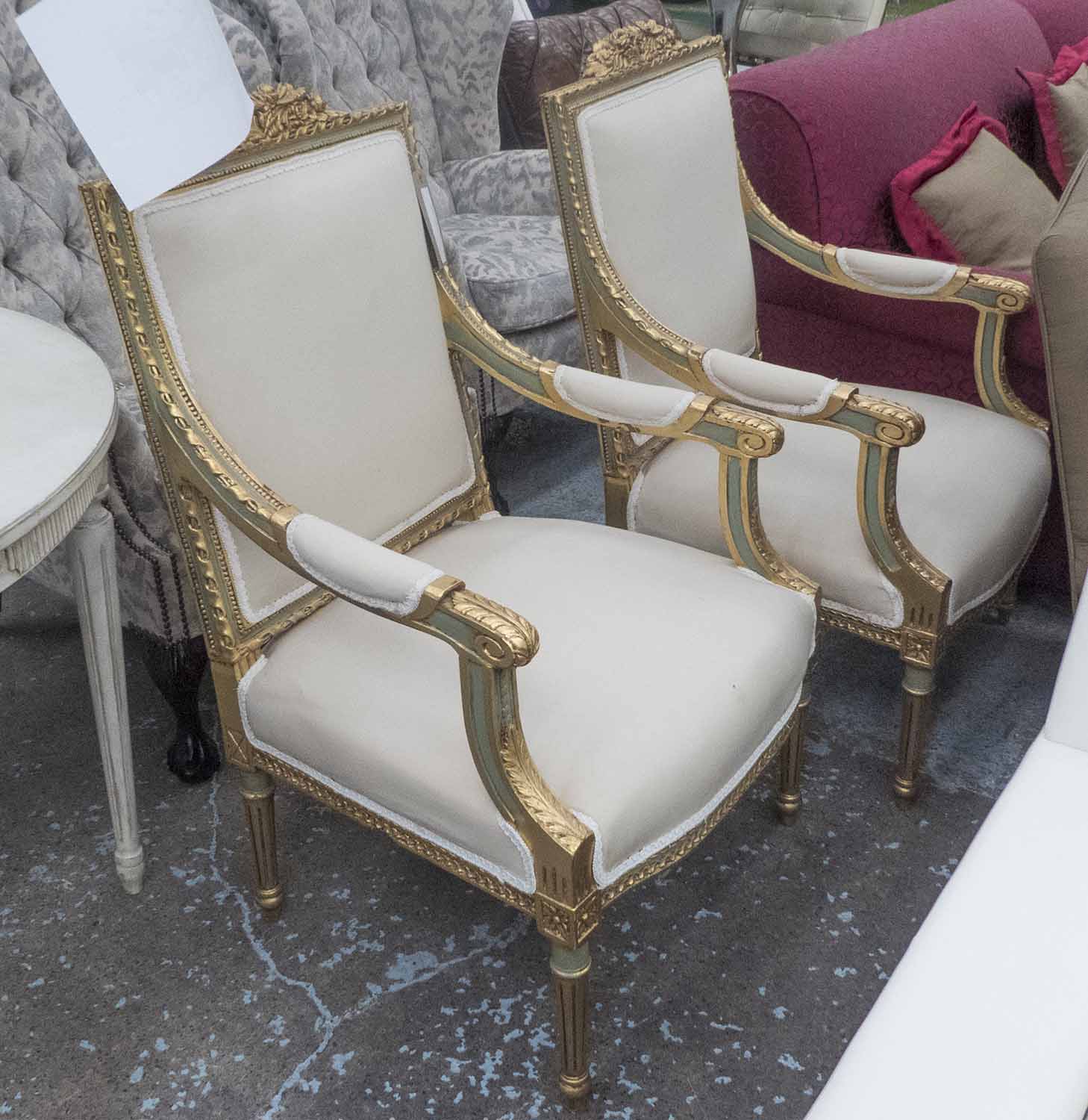 LOUIS XVI STYLE FAUTEUILS, a pair, with decorative gilt frames.