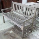 GARDEN BENCH, weathered teak, of slatted construction, 125cm W.