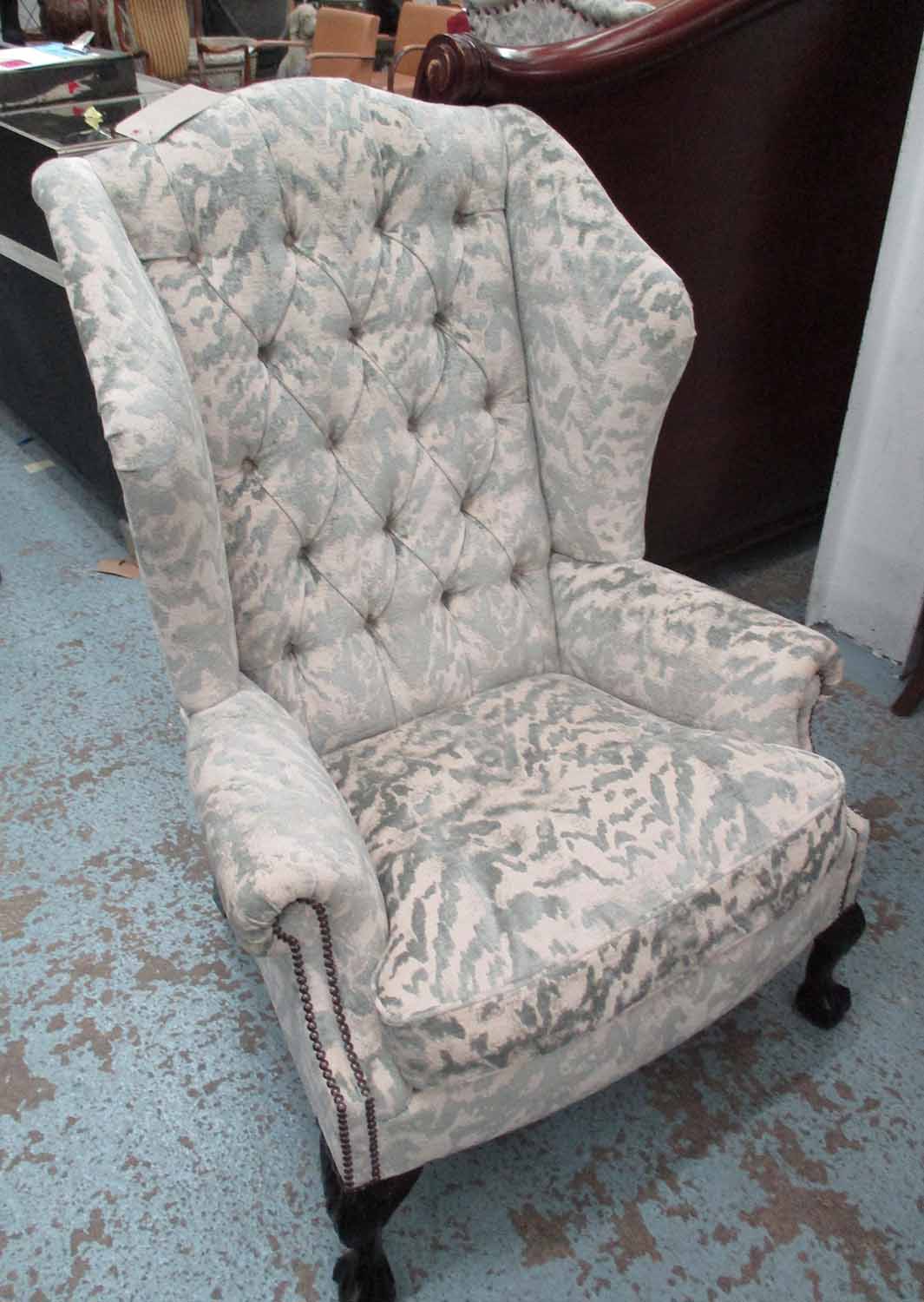 WINGBACK ARMCHAIR, in patterned fabric with button back and claw and ball feet, 85cm W x 122cm H.