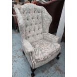 WINGBACK ARMCHAIR, in patterned fabric with button back and claw and ball feet, 85cm W x 122cm H.