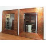 WALL MIRRORS, a pair, rectangular mottled copper, each with a bevelled plate, 75cm W x 91cm H.