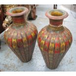 URNS, a pair, wooden ornately decorated, 86cm H.