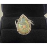 AN 18K WHITE GOLD PEAR SHAPED OPAL AND DIAMOND CLUSTER RING, opal 4.