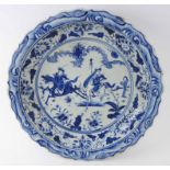 20TH CENTURY CHINESE CHARGER, blue and white, depicting riders on horseback in a landscape,