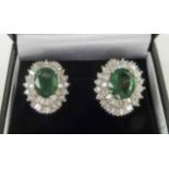 PAIR OF LARGE 18K WHITE GOLD, emerald and diamond set earrings, emerald 6.69ct baguette diamonds 1.