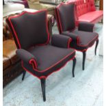 FAUTEUILS, a pair, 'noir et rouge', upholstered on ebonised frames.