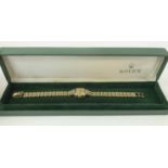 ROLEX LADIES WRITSTWATCH WITH 9K GOLD STRAP AND CASE, set ten diamonds, original case and box.