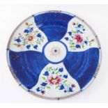 CHINESE CERAMIC CHARGER, late 18th/early 19th century, decorated blue and floral spray panels,
